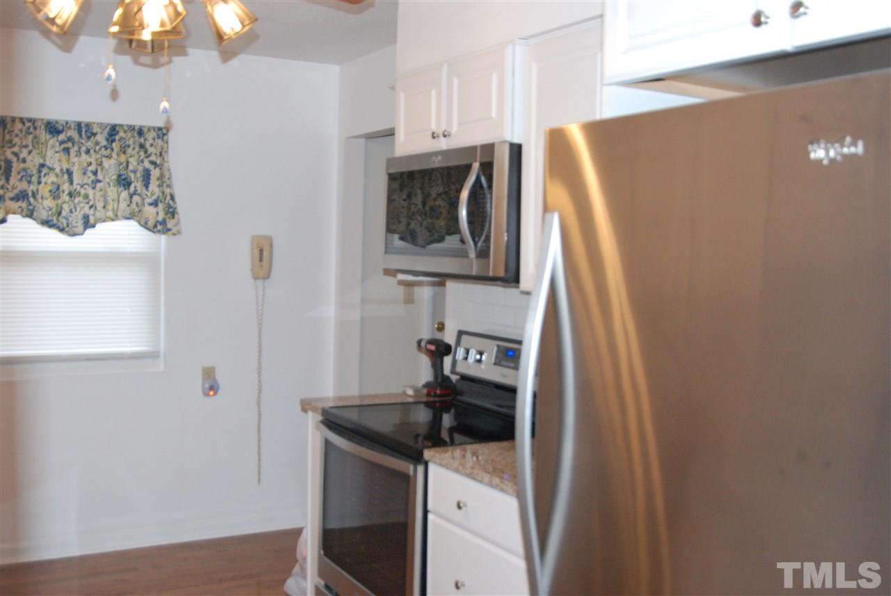 820 Bailey Road Coats, NC 27521 - Photo 3 of 21 a kitchen with a sink and a stove top oven