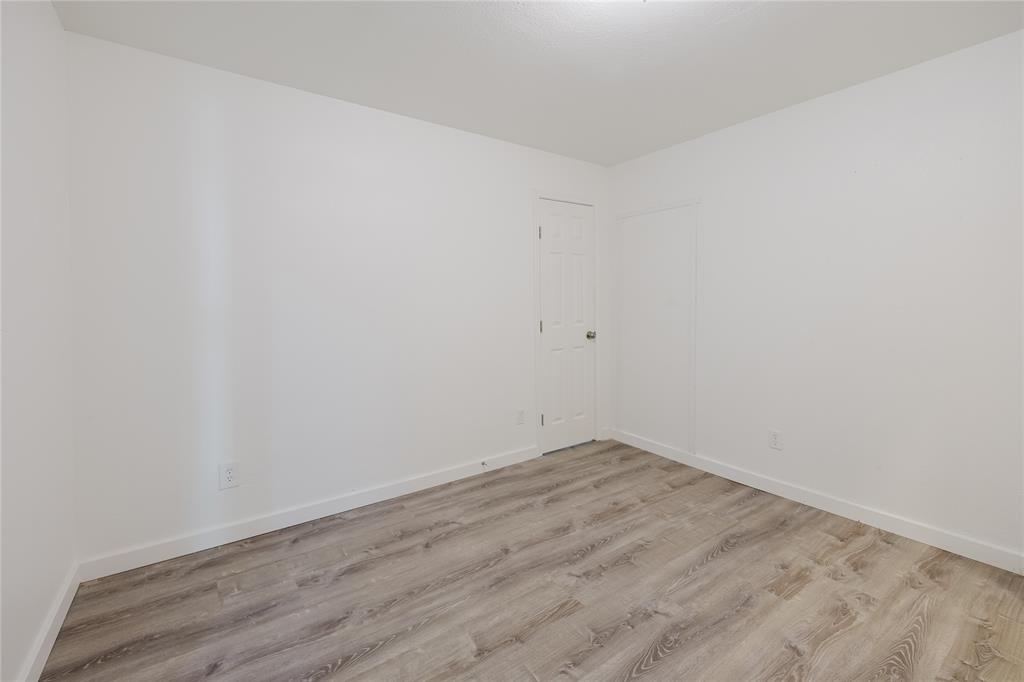 524 West Roberts Street Gorman, TX 76454 - Photo 22 of 35 an empty room with wooden floor