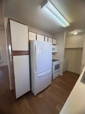 a refrigerator freezer sitting inside of a kitchen