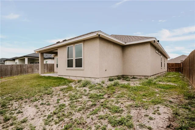 a house with trees in the background