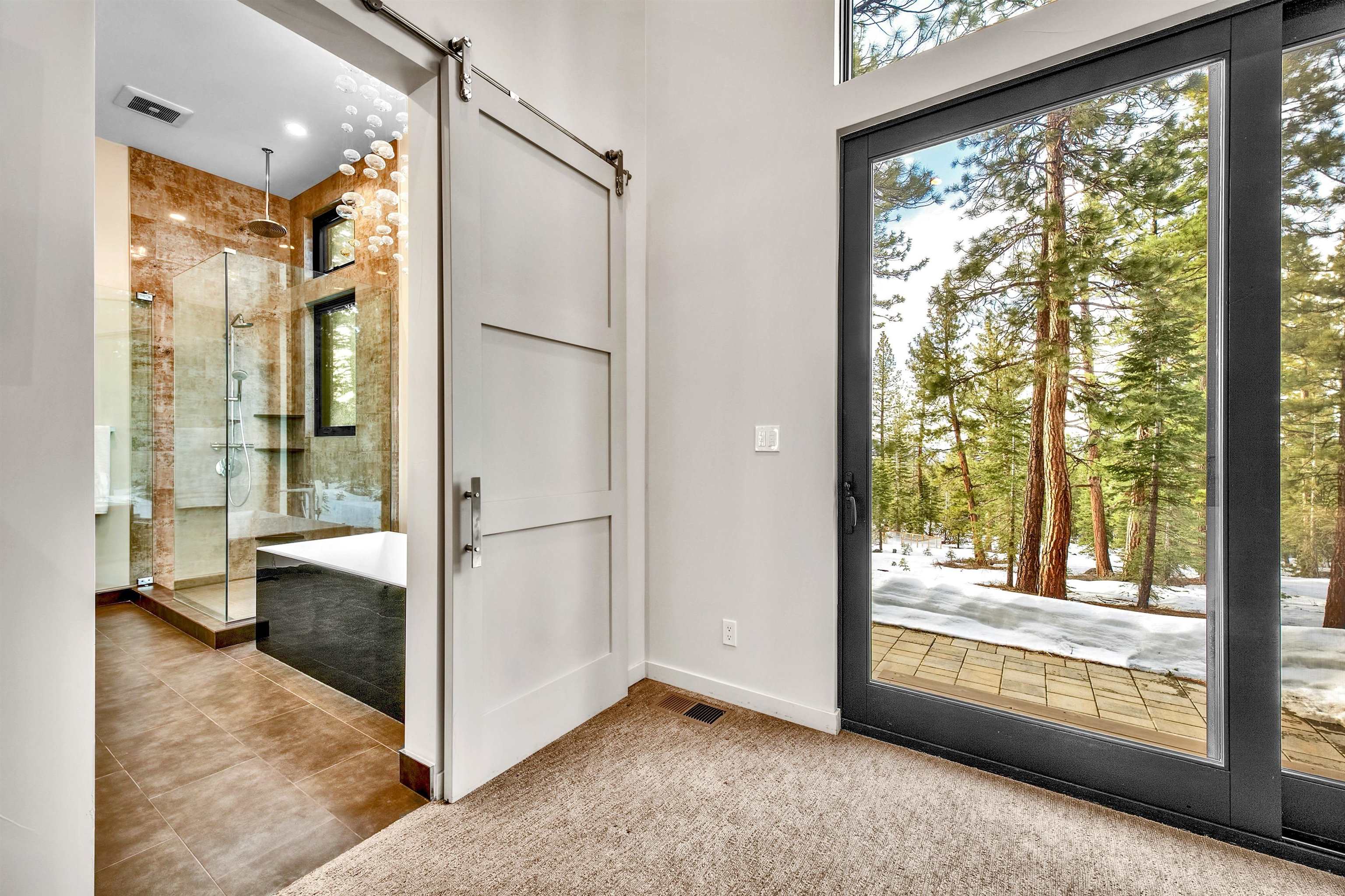 17144 Uxbridge Drive Truckee, CA 96161 - Photo 11 of 21 a view of an empty room with a window and hardwood floor