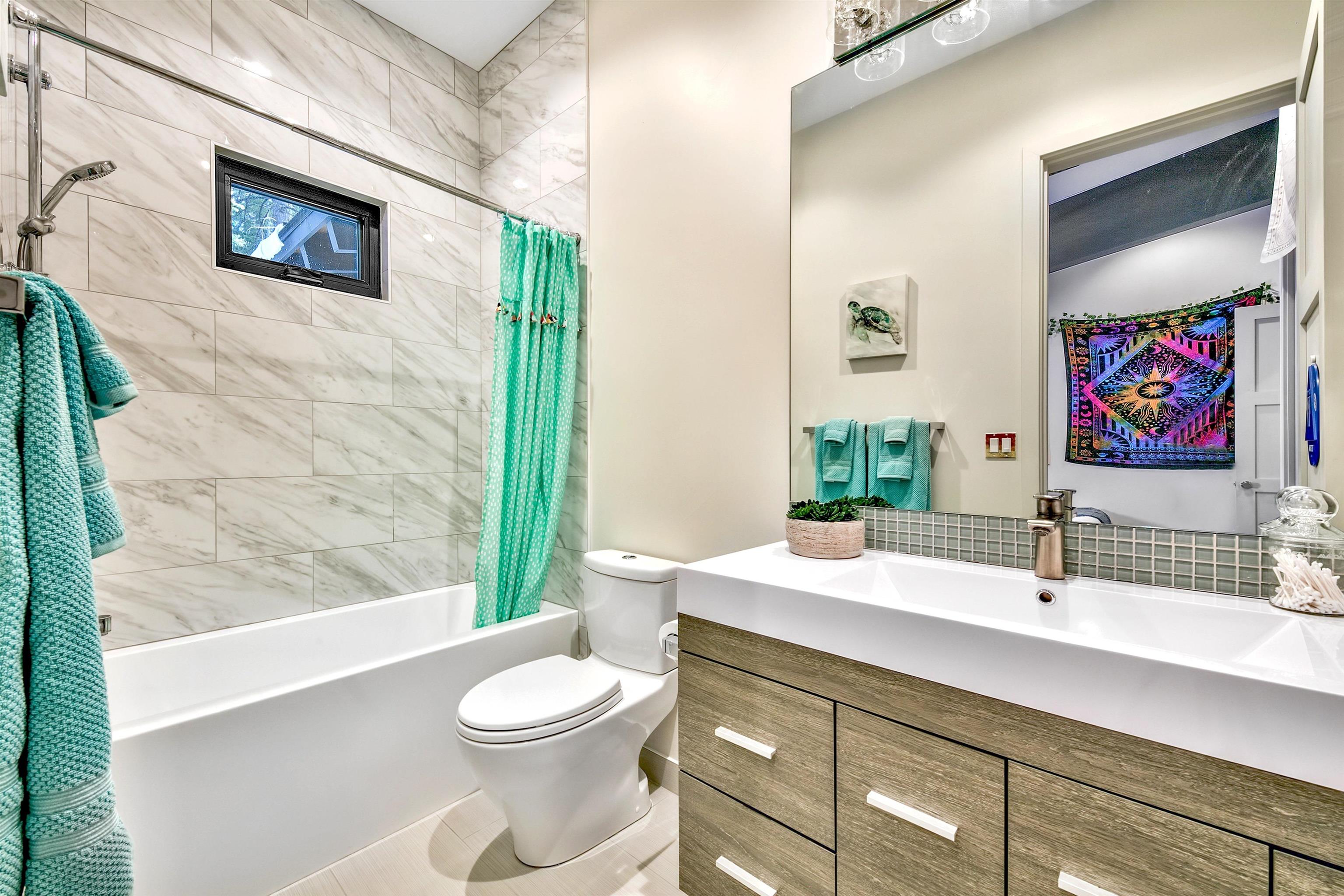 17144 Uxbridge Drive Truckee, CA 96161 - Photo 15 of 21 a bathroom with a sink a toilet and shower