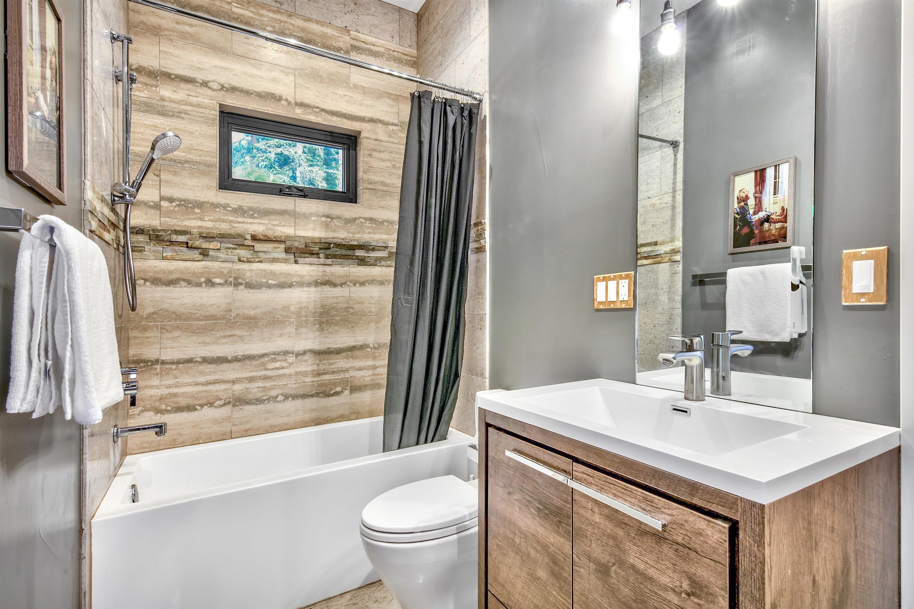 17144 Uxbridge Drive Truckee, CA 96161 - Photo 17 of 21 a bathroom with a sink and a mirror