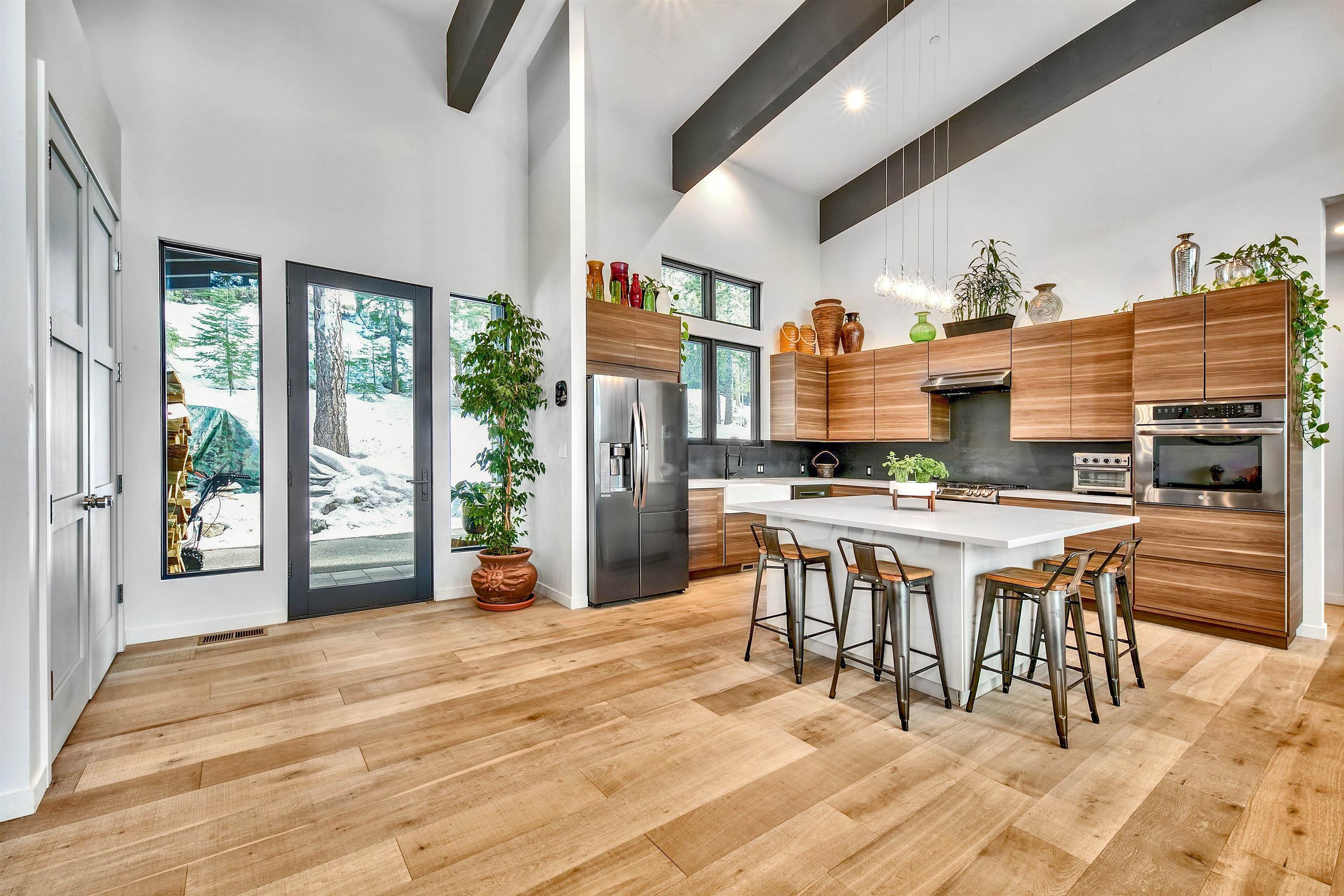 17144 Uxbridge Drive Truckee, CA 96161 - Photo 4 of 21 a dining hall with stainless steel appliances granite countertop a stove and a dining table chair