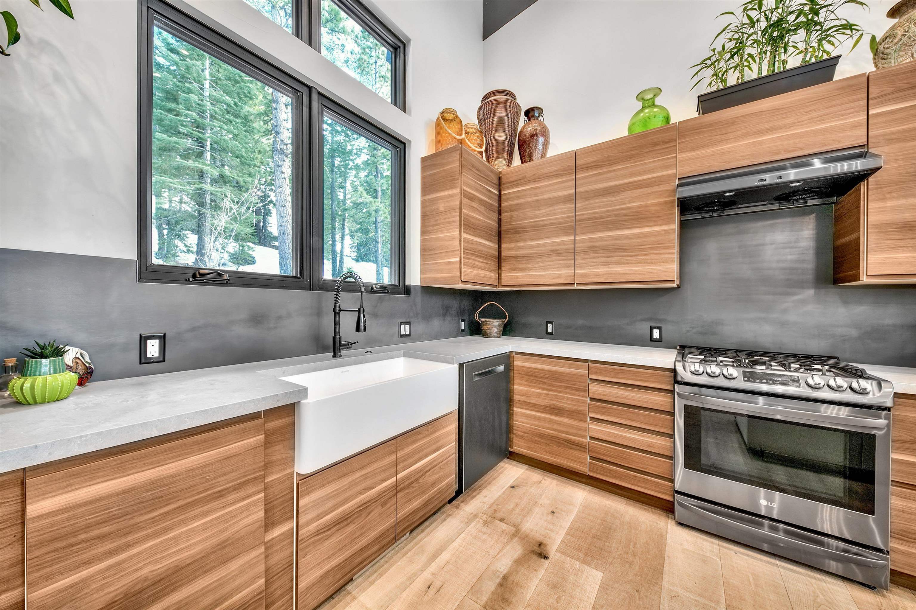 17144 Uxbridge Drive Truckee, CA 96161 - Photo 5 of 21 a kitchen with granite countertop a stove a sink and a window