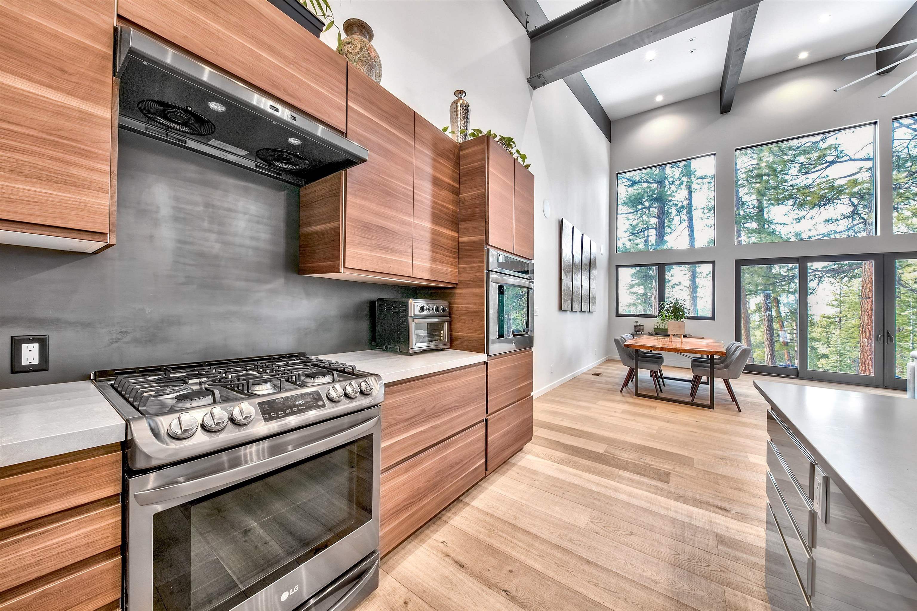 17144 Uxbridge Drive Truckee, CA 96161 - Photo 6 of 21 a kitchen with stainless steel appliances granite countertop a stove and a wooden cabinets