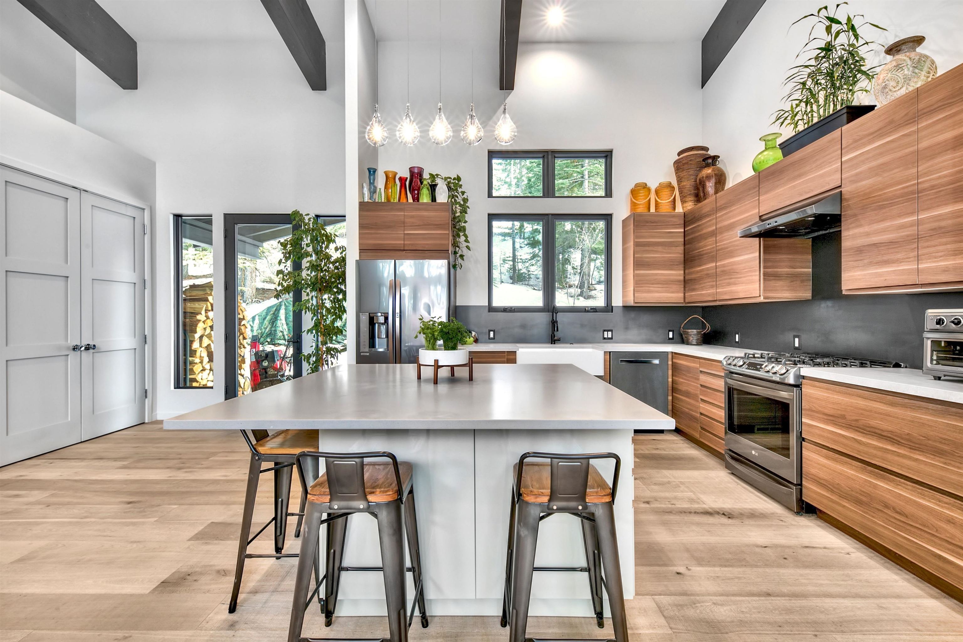 17144 Uxbridge Drive Truckee, CA 96161 - Photo 7 of 21 a kitchen with stainless steel appliances granite countertop a table chairs sink and cabinets