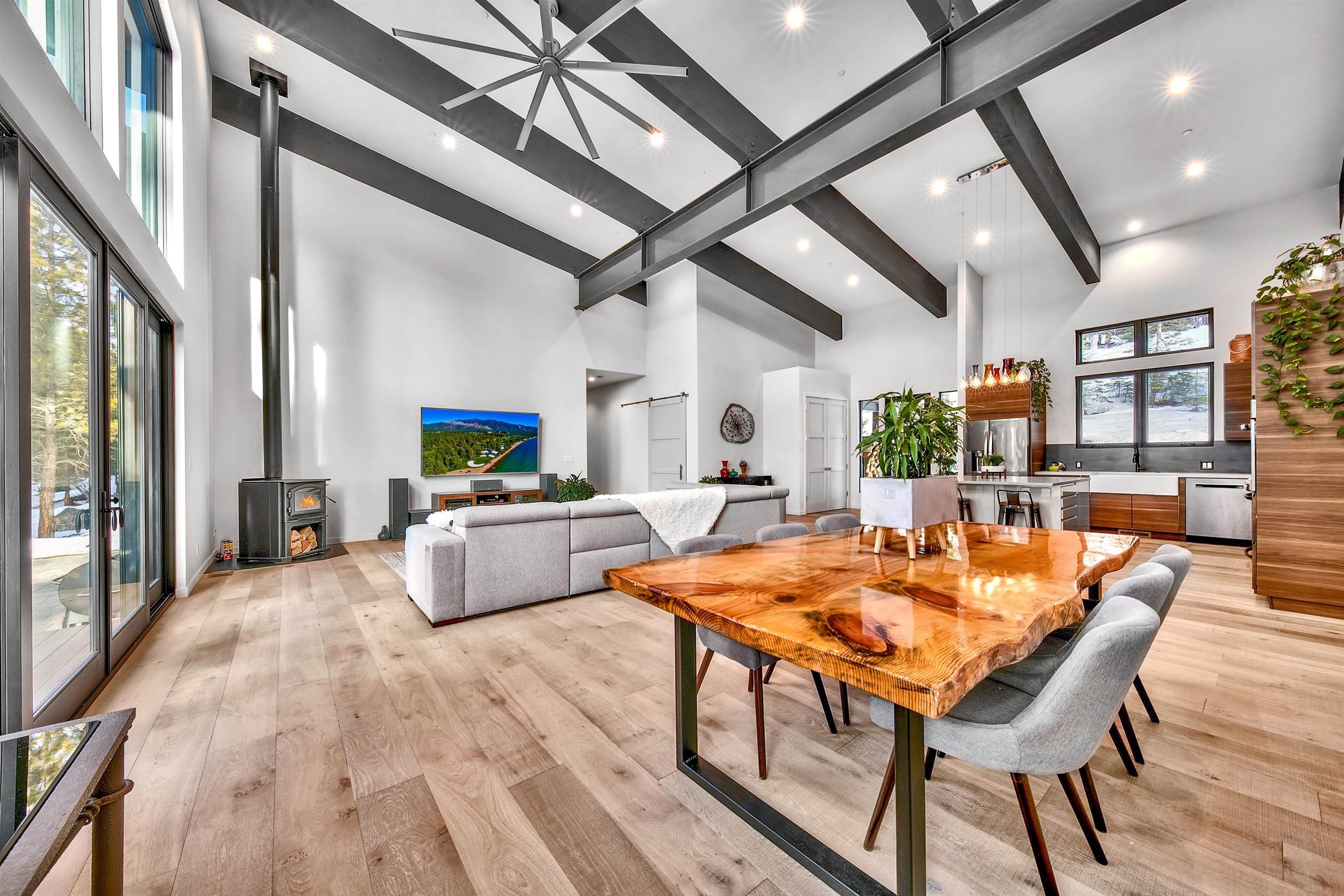 17144 Uxbridge Drive Truckee, CA 96161 - Photo 8 of 21 a dining hall with stainless steel appliances kitchen island granite countertop a dining table and chairs with wooden floor