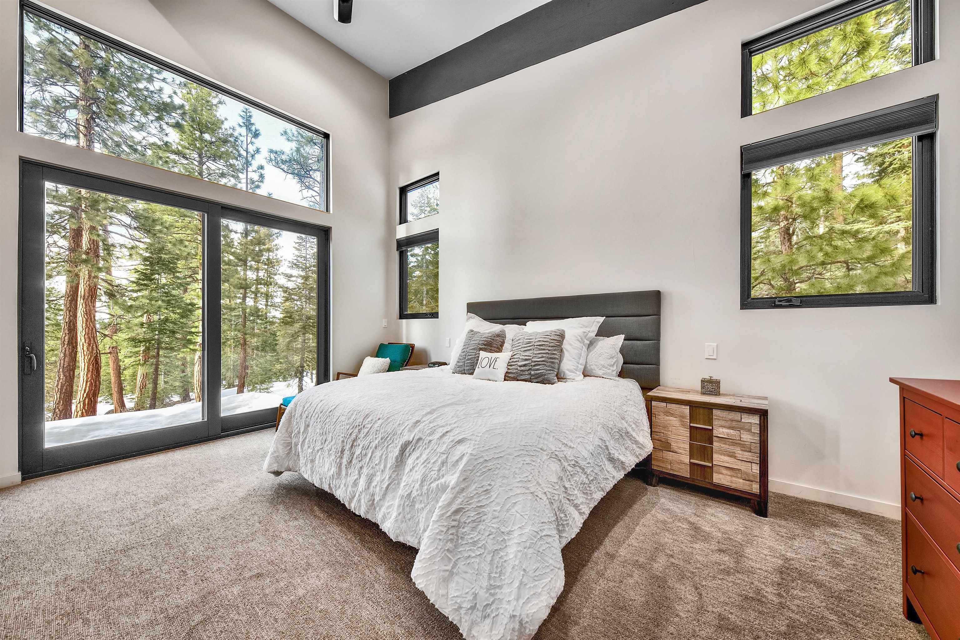 17144 Uxbridge Drive Truckee, CA 96161 - Photo 9 of 21 a bedroom with a bed and a large window