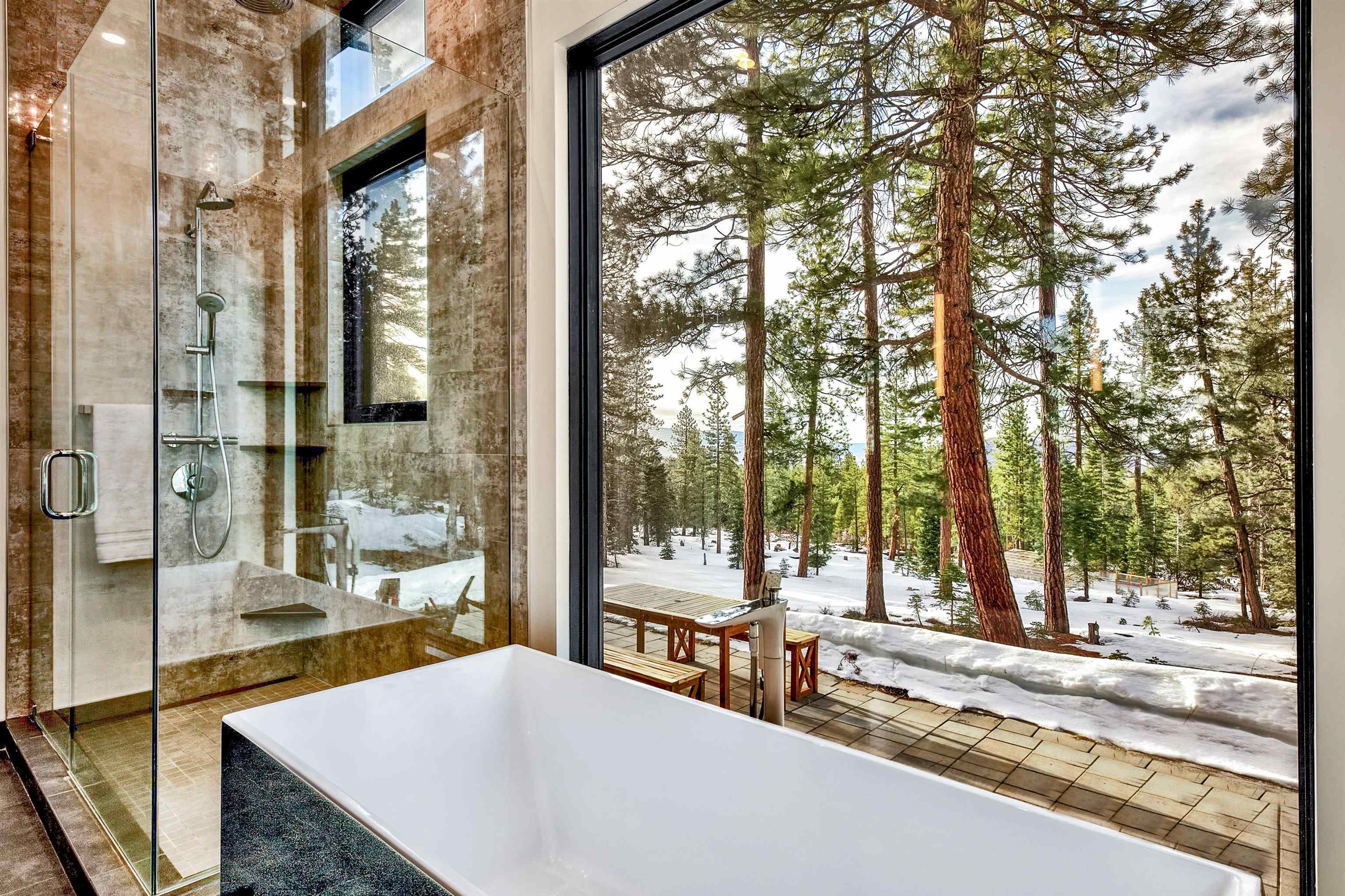 17144 Uxbridge Drive Truckee, CA 96161 - Photo 10 of 21 a view of a patio with a table and chairs and couches with wooden fence