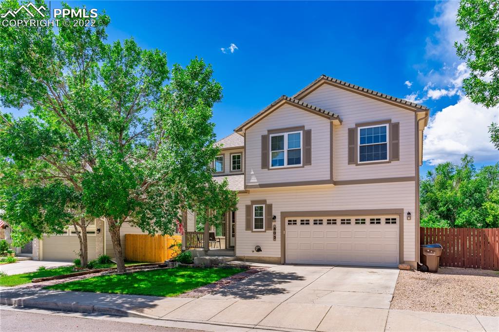 803 Ridgebury Place Fountain, CO 80817 - Photo 1 of 45 a front view of a house with a yard and a garage