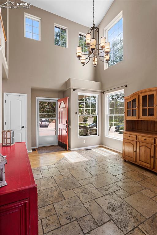 803 Ridgebury Place Fountain, CO 80817 - Photo 12 of 45 a view of a livingroom with a furniture a chandelier and window
