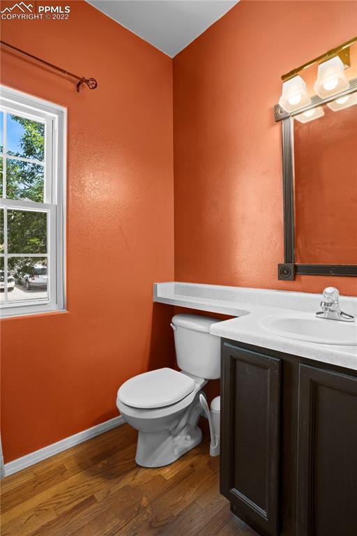 803 Ridgebury Place Fountain, CO 80817 - Photo 14 of 45 a bathroom with a toilet a sink and mirror