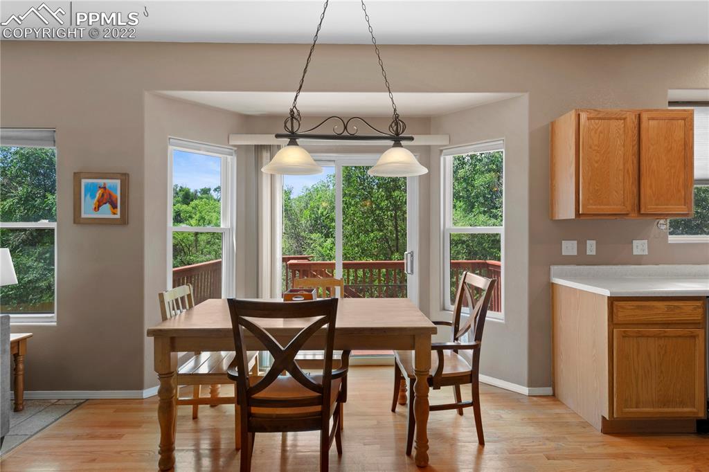 803 Ridgebury Place Fountain, CO 80817 - Photo 18 of 45 a dining room with furniture window and wooden floor