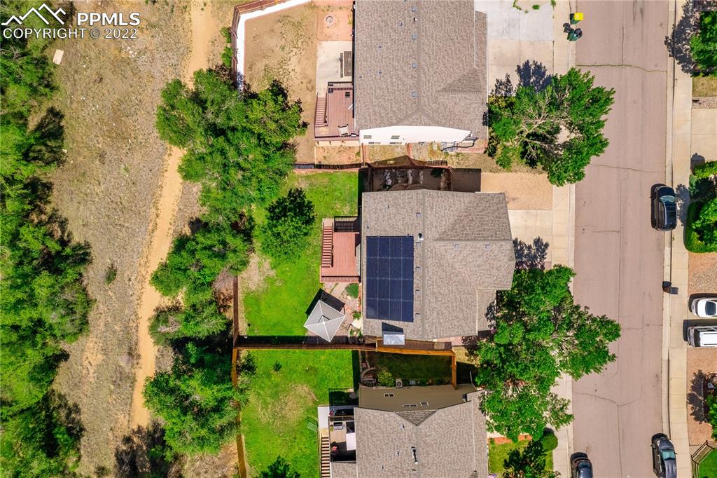 803 Ridgebury Place Fountain, CO 80817 - Photo 43 of 45 an aerial view of a house with a yard and fountain in front of it