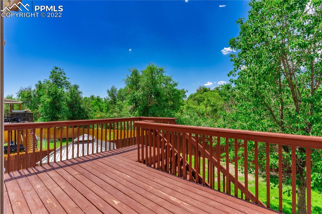 803 Ridgebury Place Fountain, CO 80817 - Photo 9 of 45 a view of balcony with wooden floor and fence