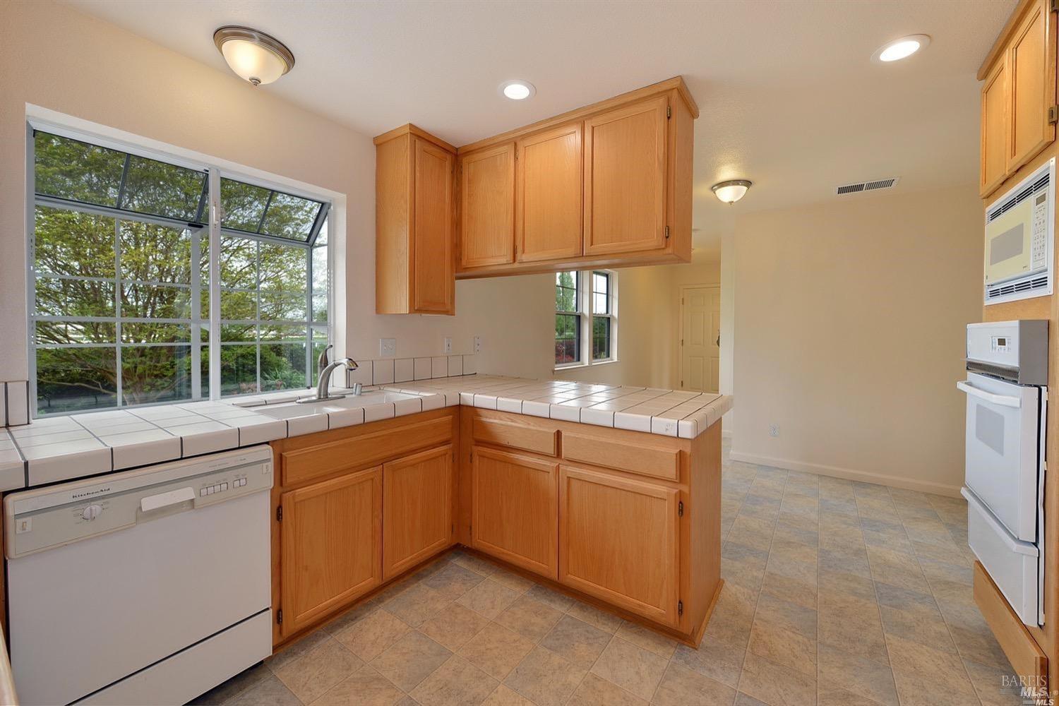 3980 Stony Point Road Santa Rosa, CA 95407 - Photo 11 of 42 a kitchen with sink cabinets and window