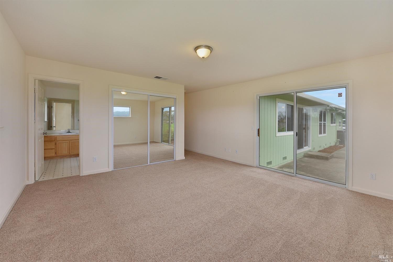 3980 Stony Point Road Santa Rosa, CA 95407 - Photo 16 of 42 an empty room with window and a kitchen
