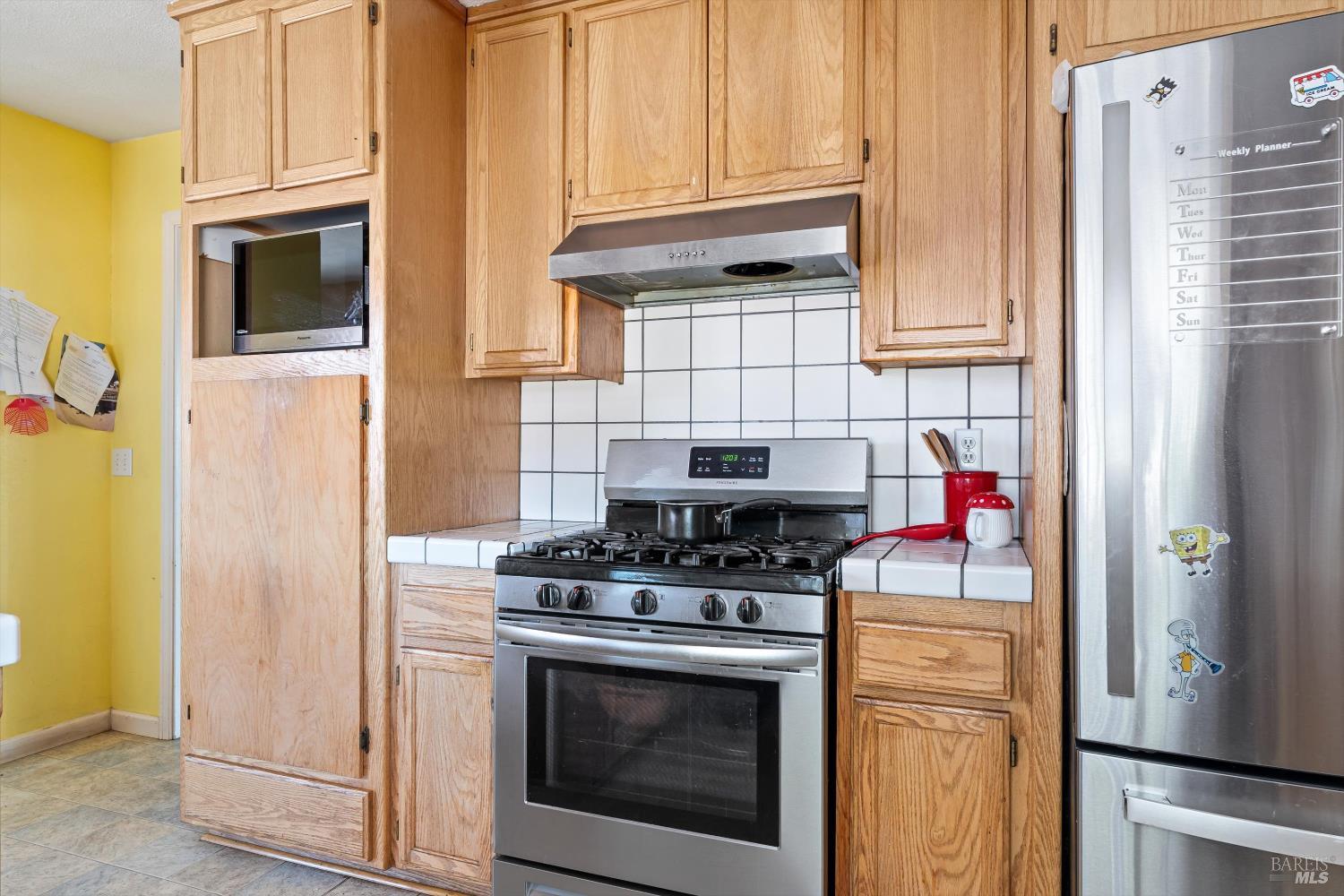 3980 Stony Point Road Santa Rosa, CA 95407 - Photo 23 of 42 a kitchen with stainless steel appliances granite countertop a stove and a refrigerator