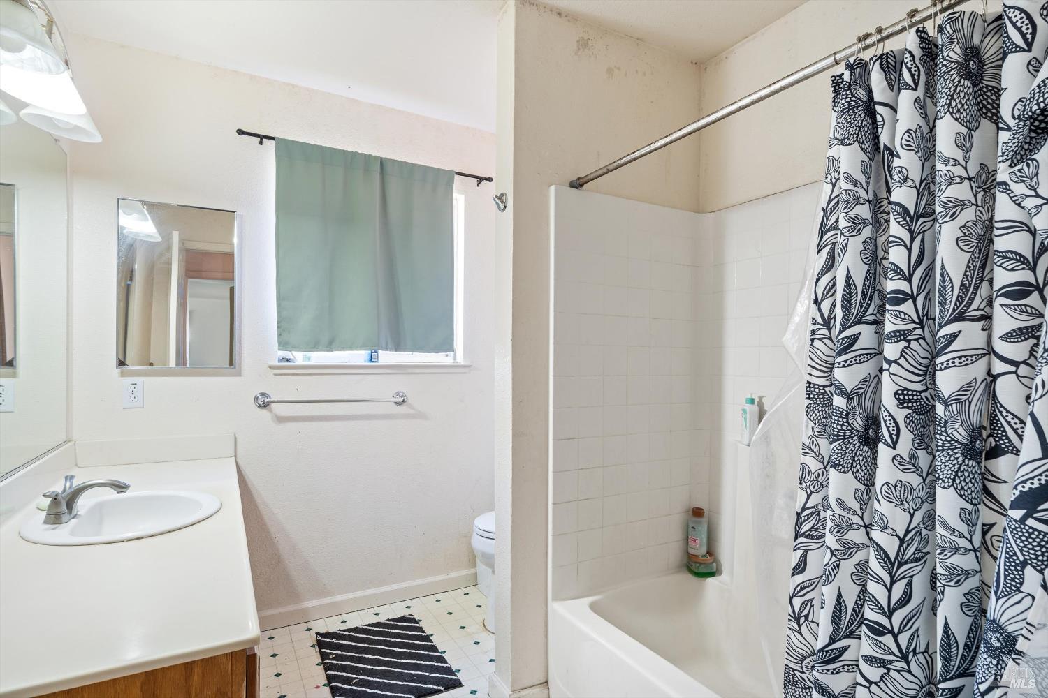 3980 Stony Point Road Santa Rosa, CA 95407 - Photo 27 of 42 a bathroom with a sink and a mirror