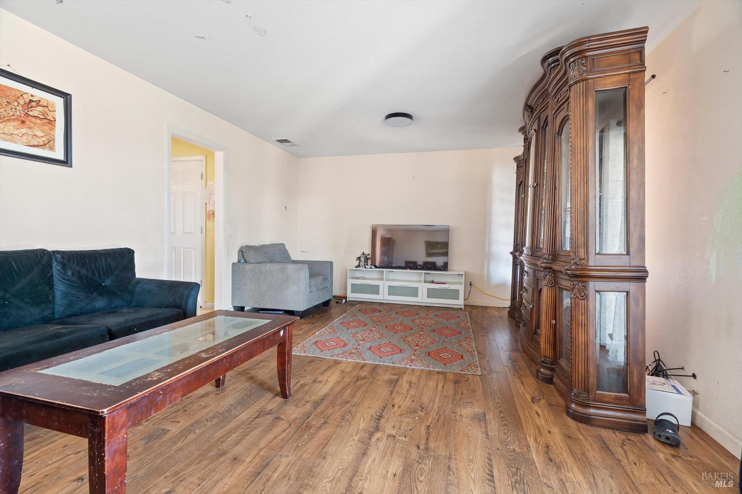 3980 Stony Point Road Santa Rosa, CA 95407 - Photo 9 of 31 a living room with furniture and a wooden floor