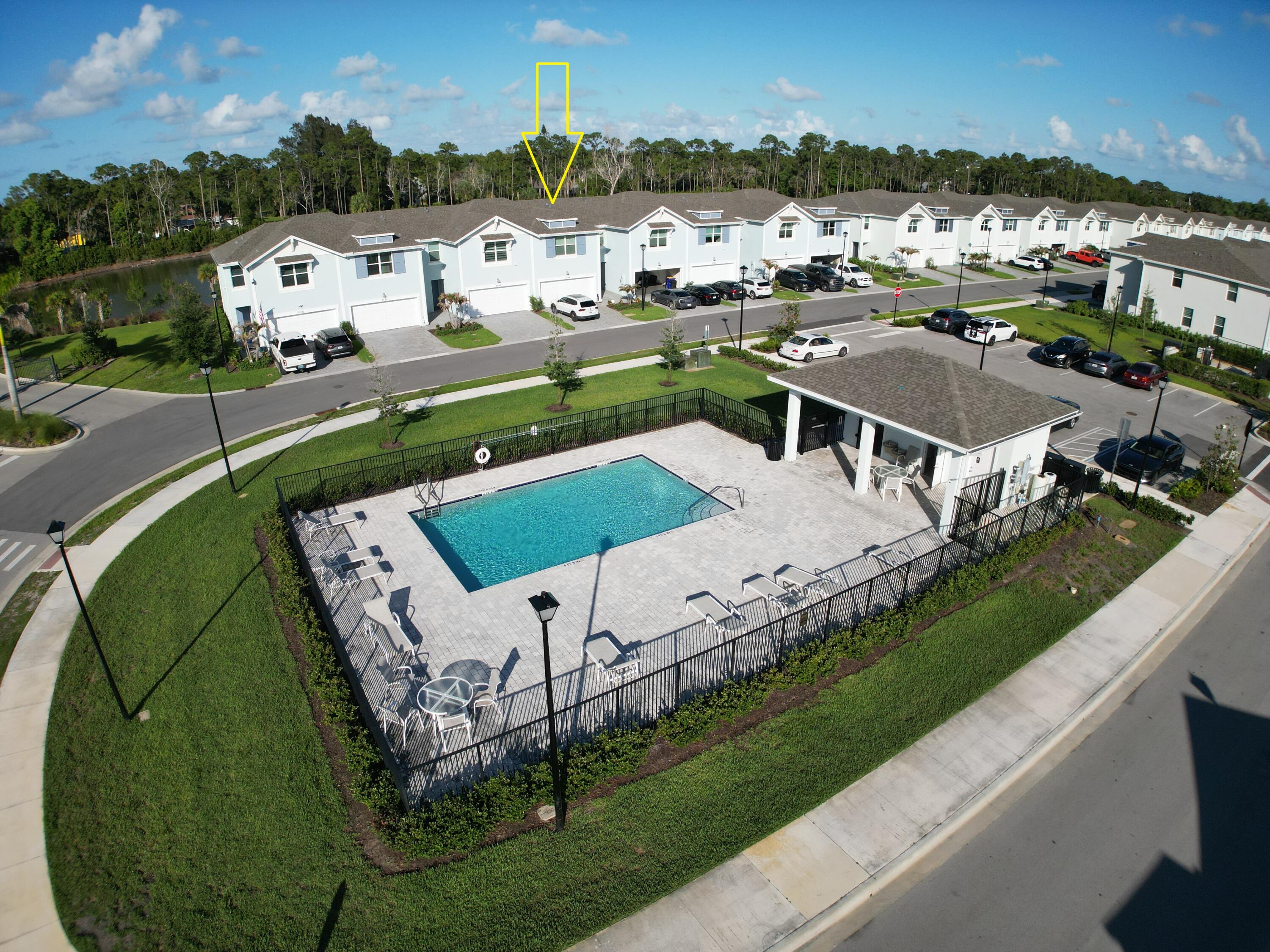 5784 Southeast Edgewater Circle Stuart, FL 34997 - Photo 21 of 33 an aerial view of a house with a garden and lake view