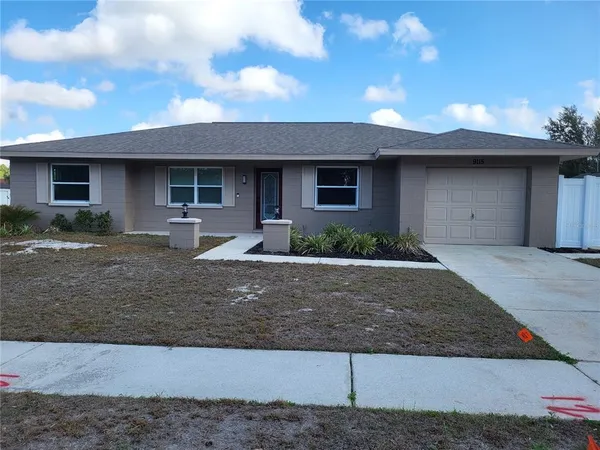 a front view of a house with garage