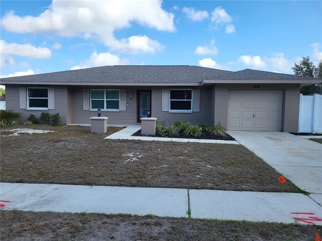 a front view of a house with garage