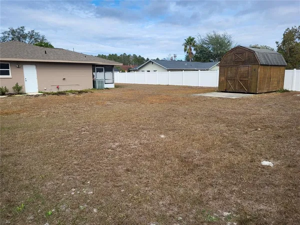 a house with trees in the background