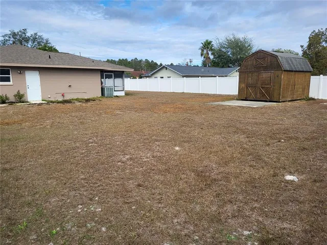 a house with trees in the background