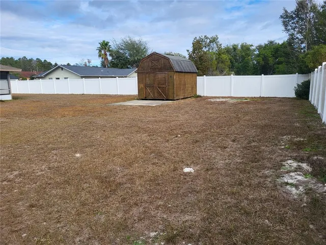 a view of a room with wooden walls