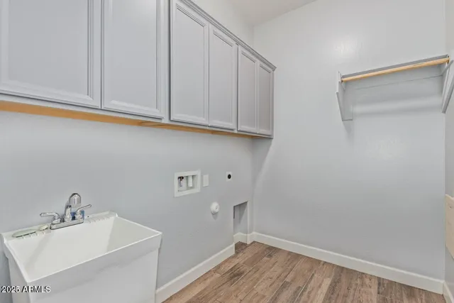 a bathroom with a sink and cabinets