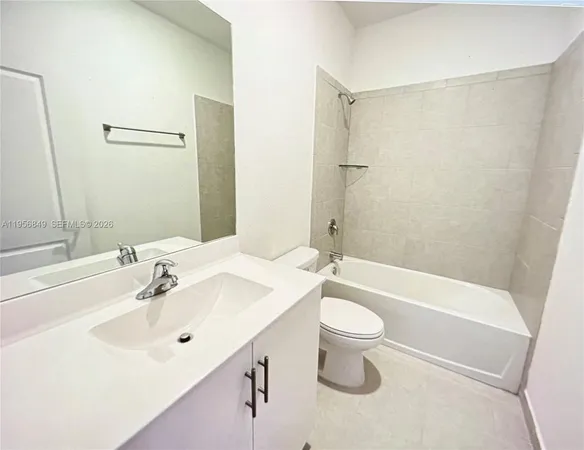 a bathroom with a sink a toilet and a bathtub