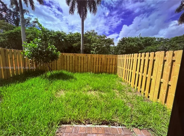 a view of a garden with a tree