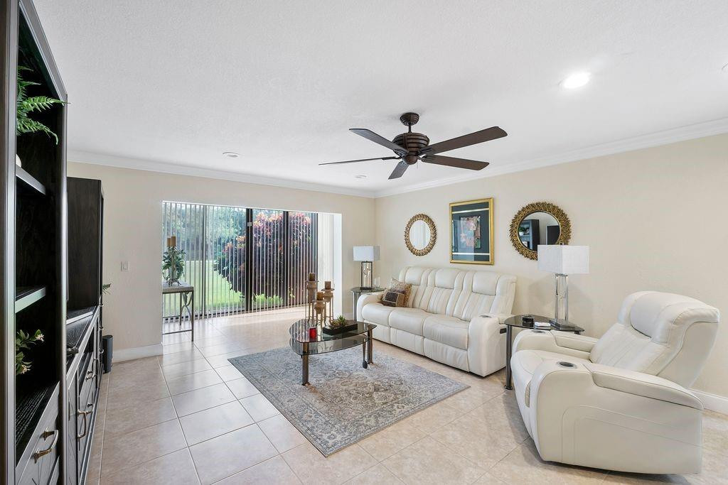 21452 Juego Circle, Unit 31A Boca Raton, FL 33433 - Photo 11 of 38 a living room with furniture and a large window