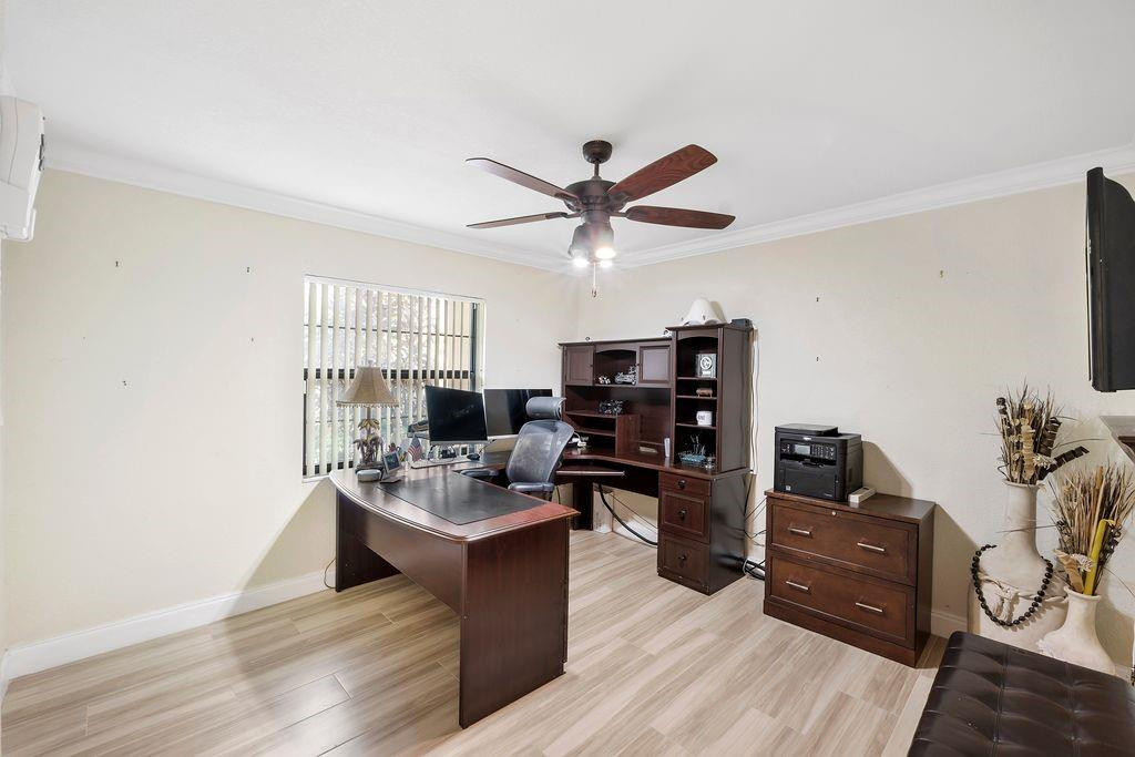 21452 Juego Circle, Unit 31A Boca Raton, FL 33433 - Photo 25 of 38 a living room with furniture and a flat screen tv