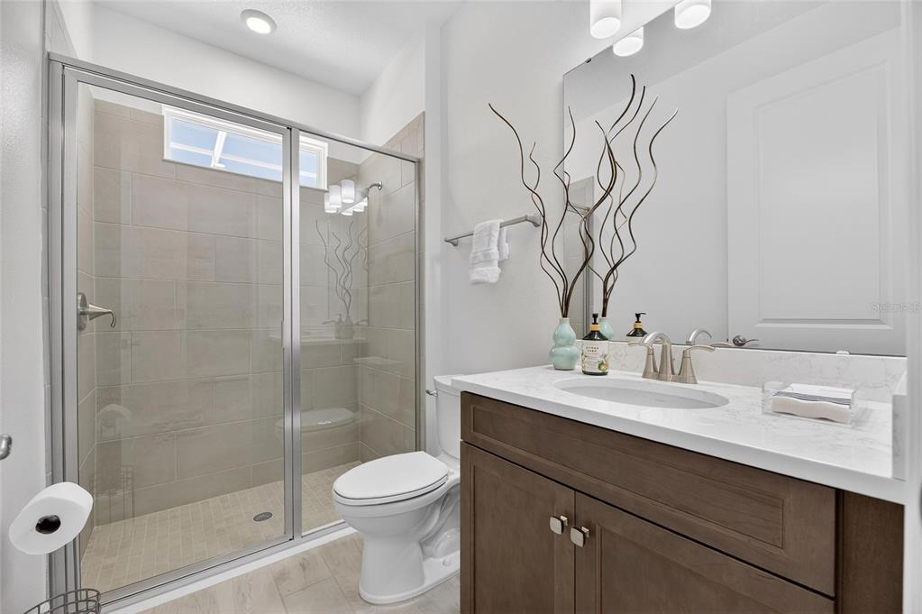 994 Signet Drive Apollo Beach, FL 33572 - Photo 46 of 98 a bathroom with a sink a toilet and shower