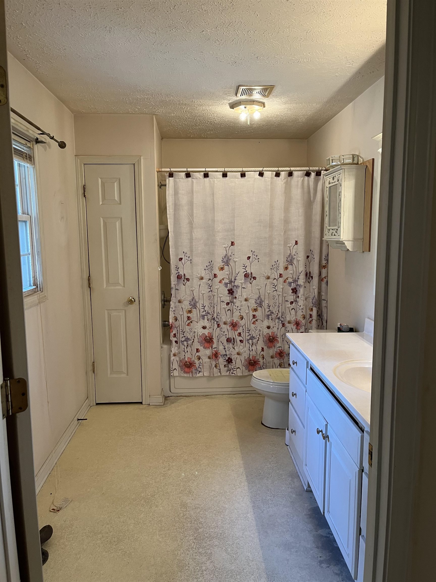 605 Blue Bonnett Road Bolivar, TN 38008 - Photo 11 of 18 a bathroom with a granite countertop sink toilet and shower