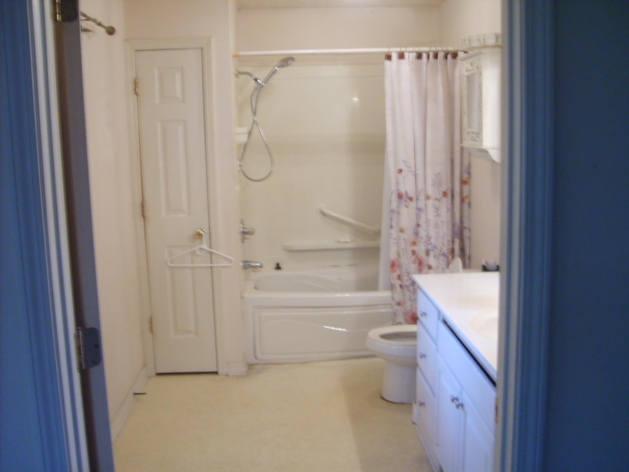 605 Blue Bonnett Road Bolivar, TN 38008 - Photo 12 of 18 a bathroom with a granite countertop bathtub shower sink vanity and toilet