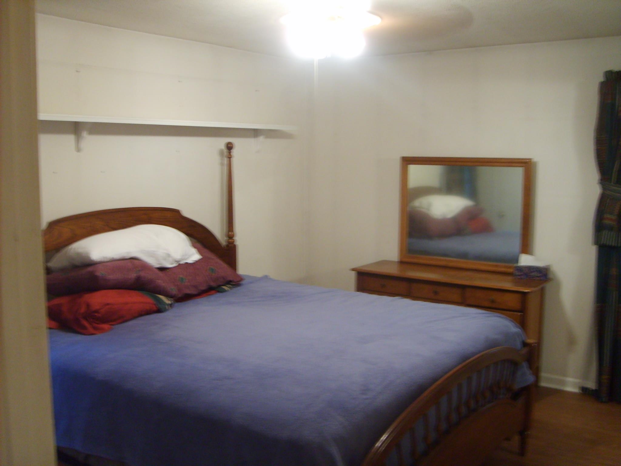 605 Blue Bonnett Road Bolivar, TN 38008 - Photo 13 of 18 a bedroom with a bed and window