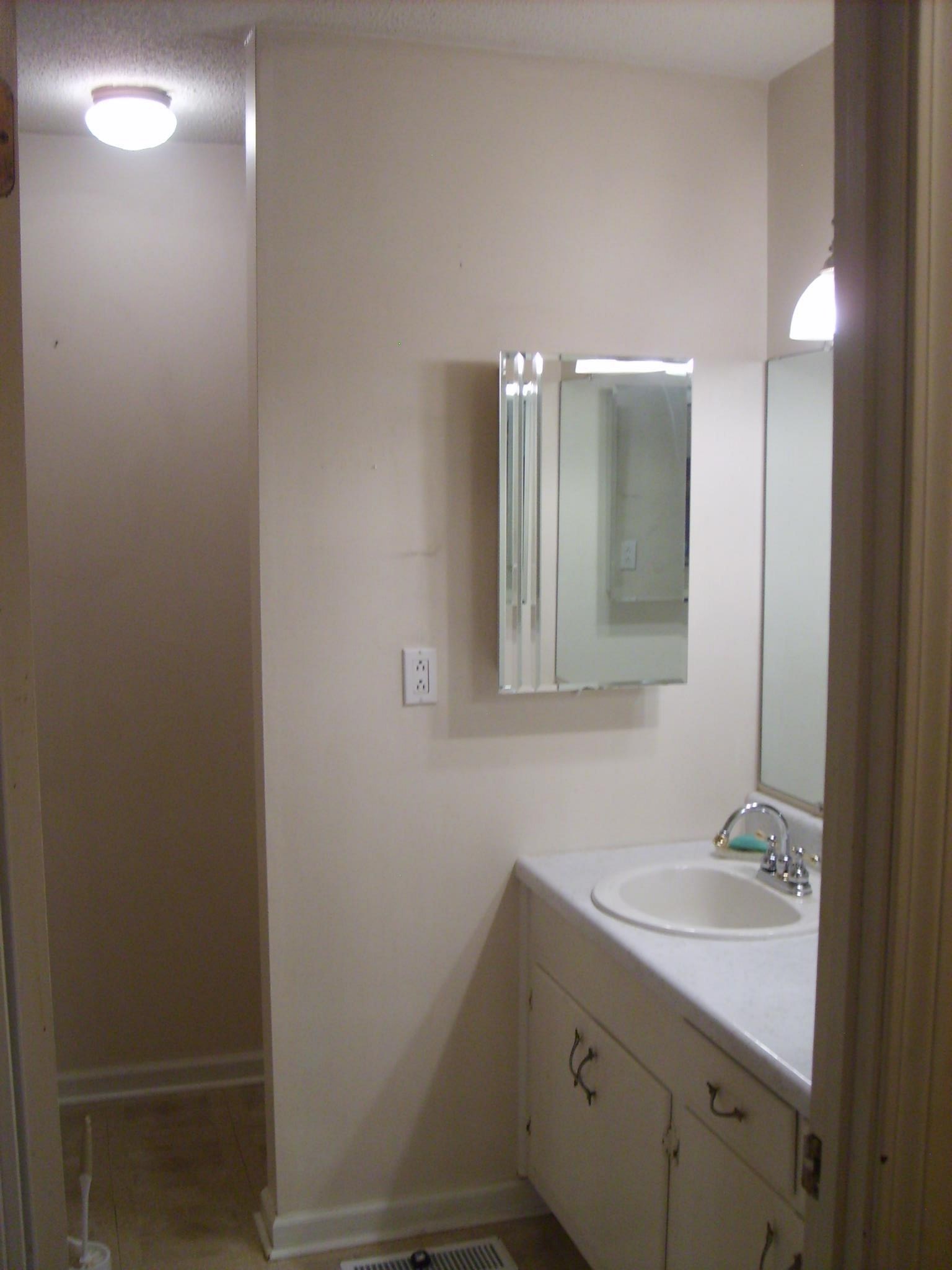 605 Blue Bonnett Road Bolivar, TN 38008 - Photo 17 of 18 a bathroom with a sink and a mirror