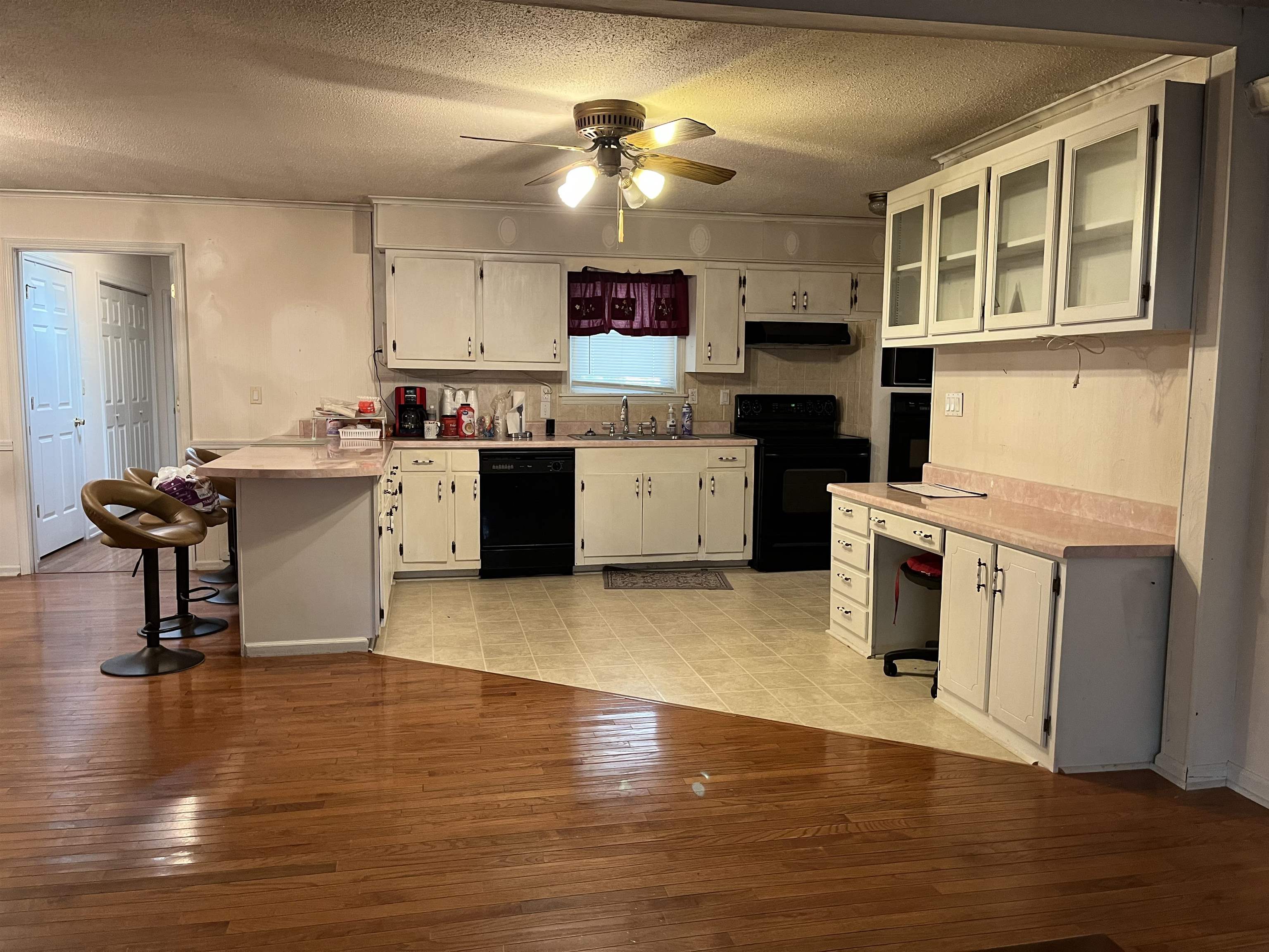 605 Blue Bonnett Road Bolivar, TN 38008 - Photo 5 of 18 a kitchen with a sink cabinets and wooden floor