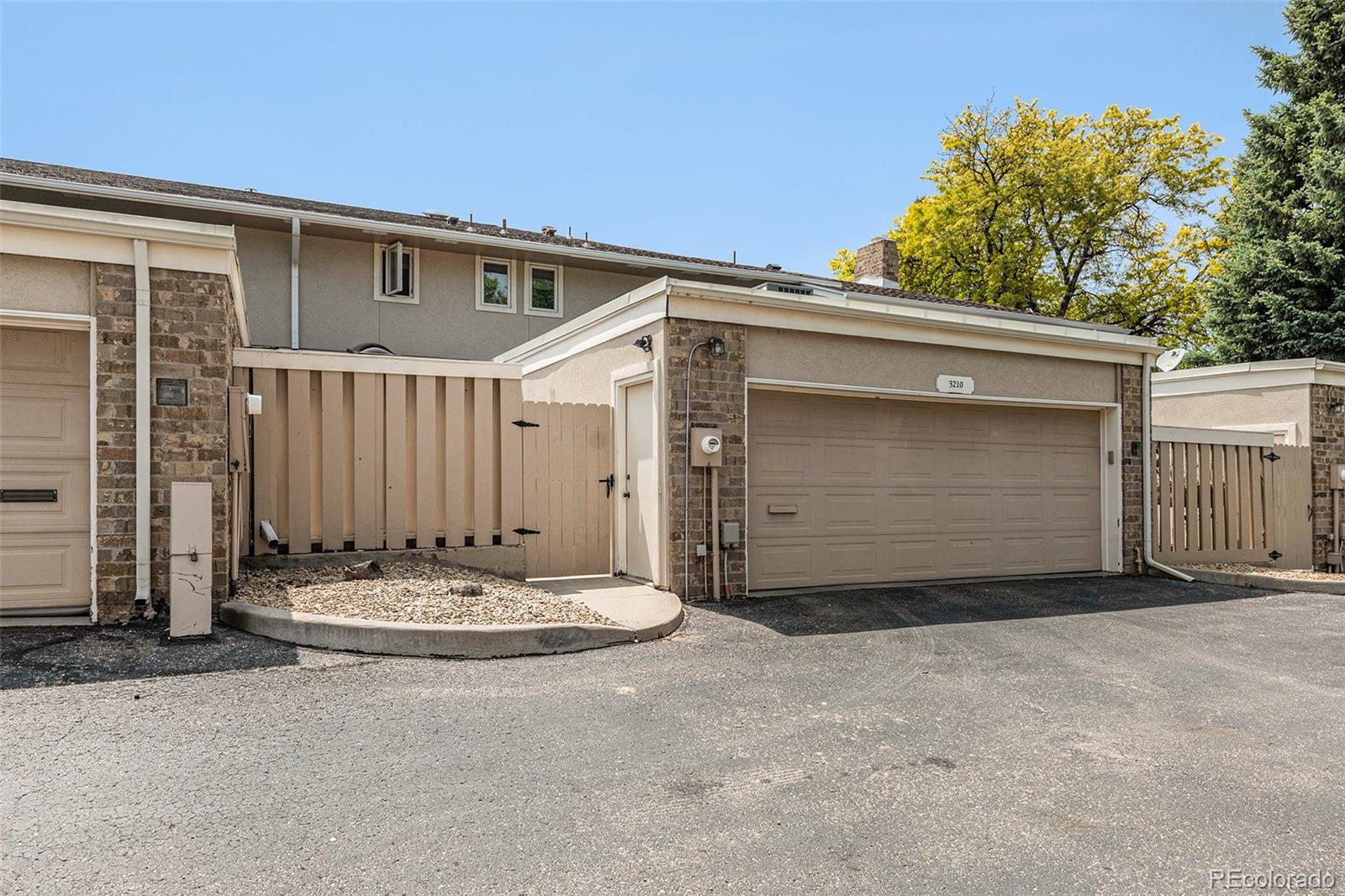 3210 South Oneida Way Denver, CO 80224 - Photo 19 of 28 a view of a house with a garage
