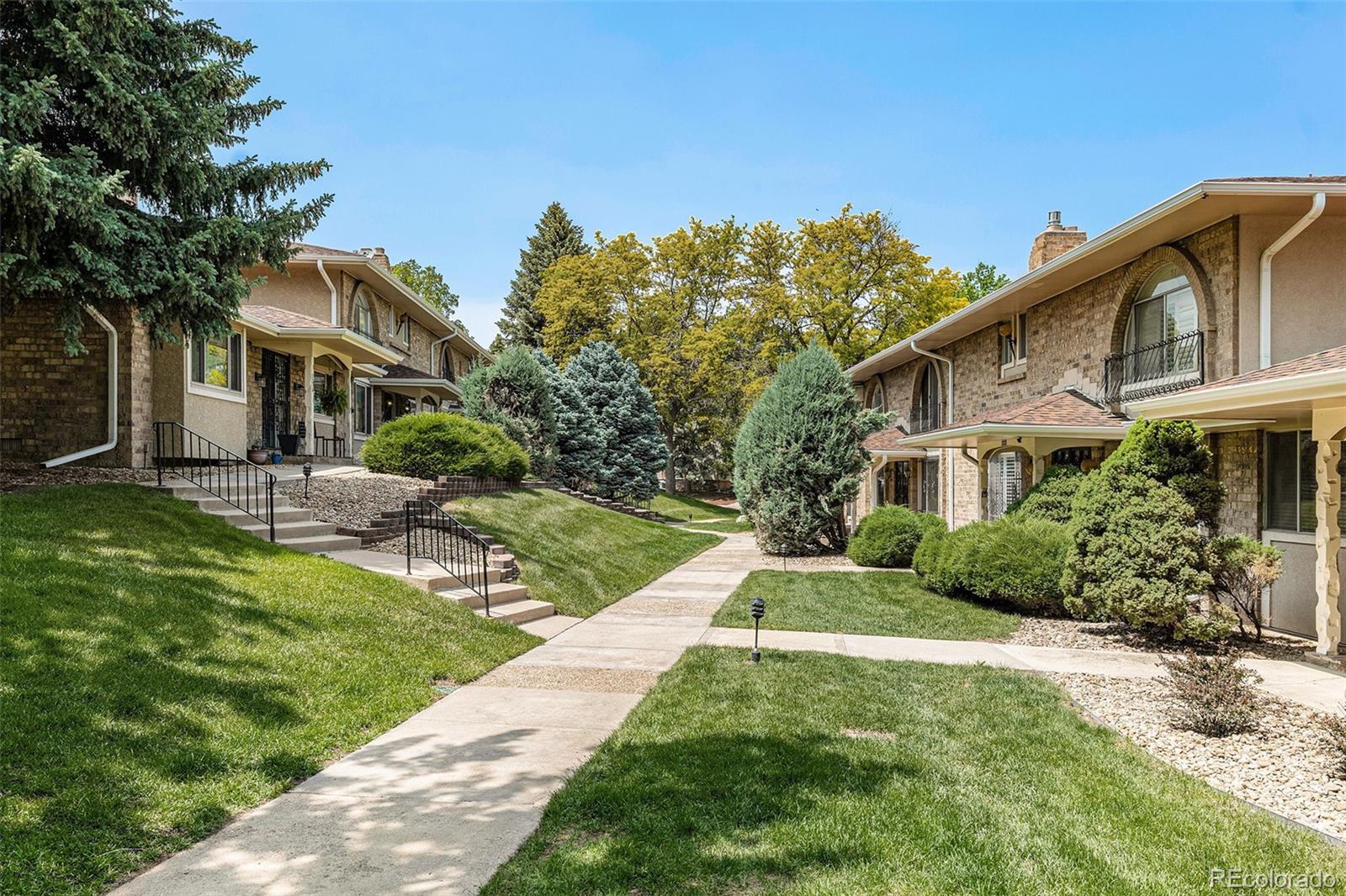 3210 South Oneida Way Denver, CO 80224 - Photo 25 of 28 a front view of a house with a yard