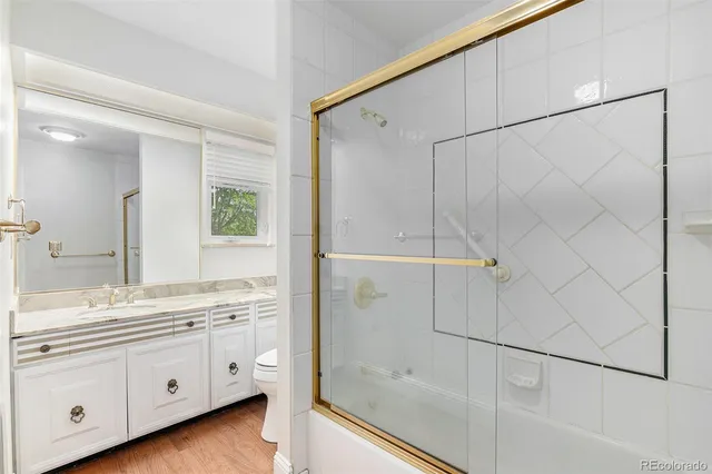 a bathroom with a double vanity sink a mirror and a shower