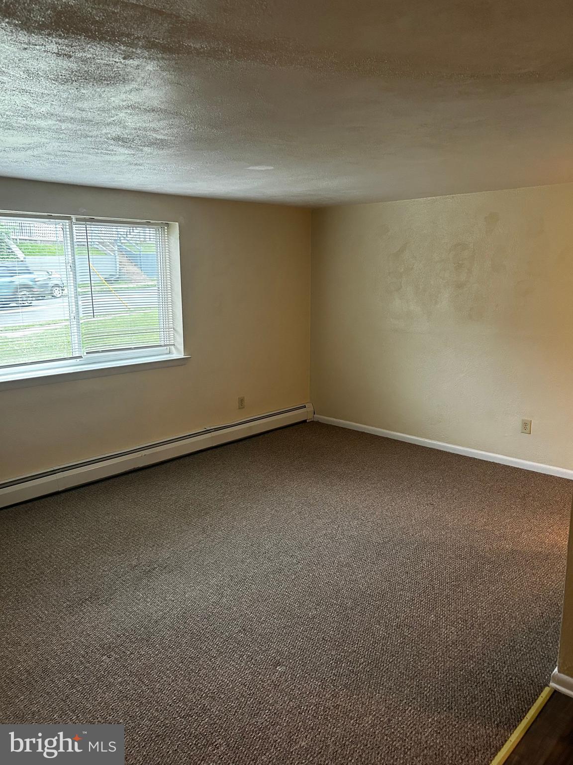 120 North Penn Street, Unit A7 Spring City, PA 19475 - Photo 4 of 13 an empty room with a window