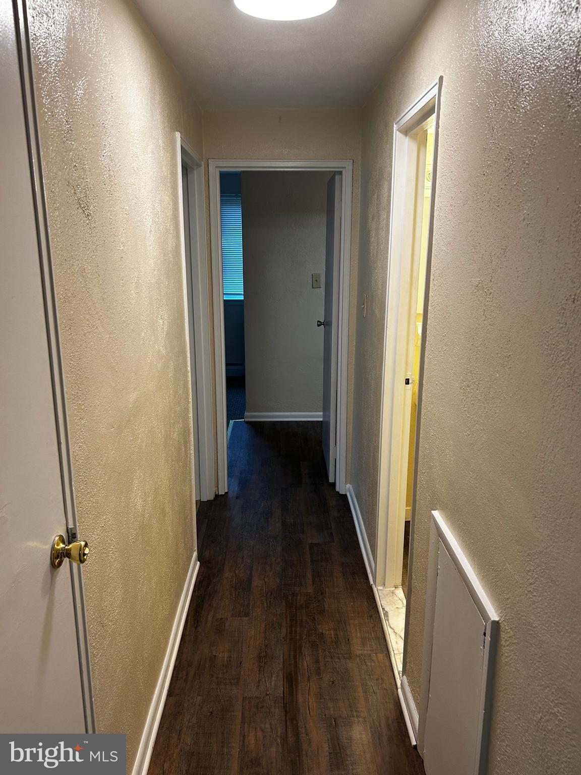 120 North Penn Street, Unit A7 Spring City, PA 19475 - Photo 7 of 13 a view of a hallway with wooden floor and staircase
