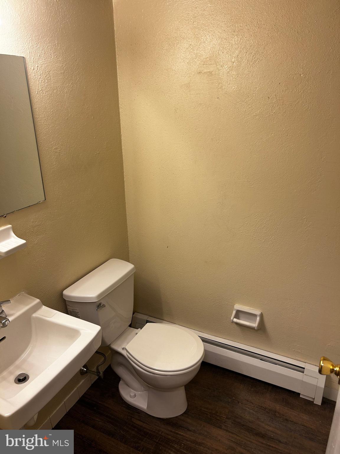 120 North Penn Street, Unit A7 Spring City, PA 19475 - Photo 8 of 13 a bathroom with a sink and a toilet