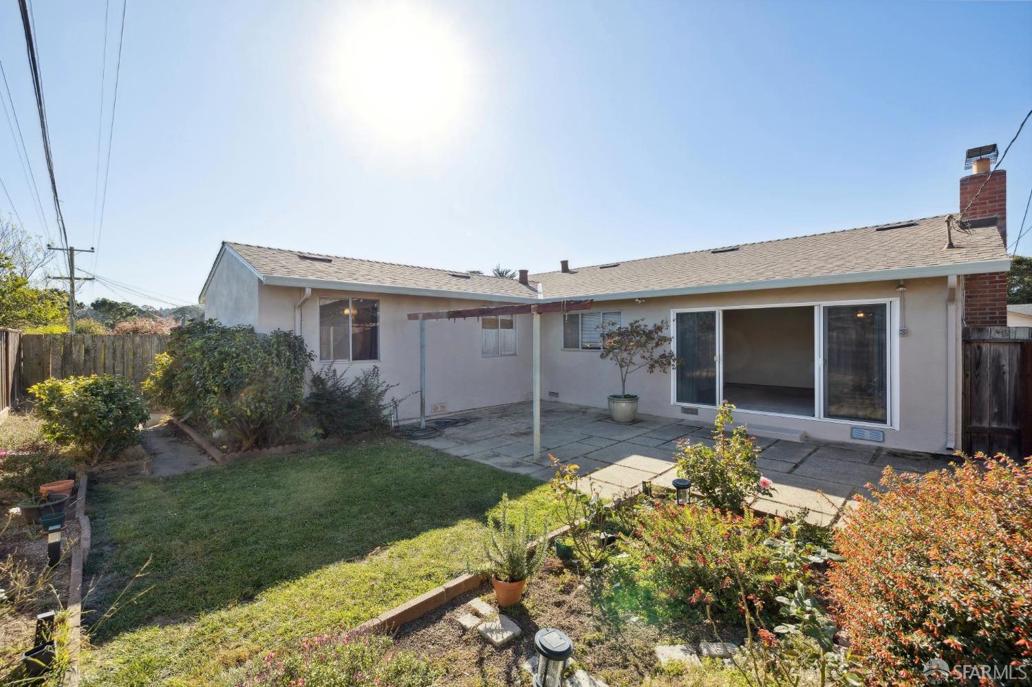 2521 Sherwood Drive San Bruno, CA 94066 - Photo 11 of 39 a front view of a house with a garden and yard