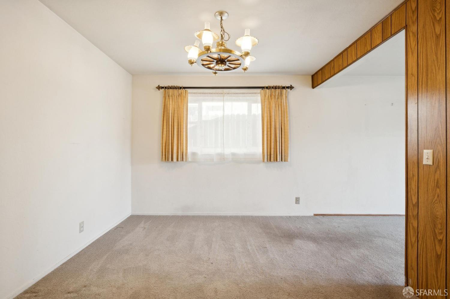 2521 Sherwood Drive San Bruno, CA 94066 - Photo 13 of 39 an empty room with windows and chandelier